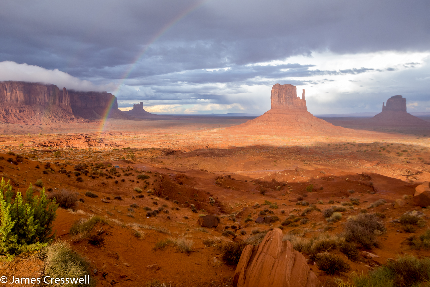 A photograph of rock towers in the desert in Monument Valley taken on a GeoWorld Travel USA geology trip, tour and holiday