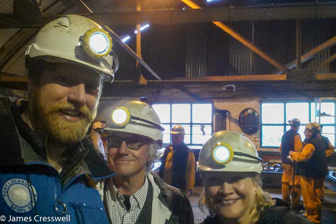 A photograph of James Cresswell and other people in hard hats with lights about to descend the Big Pit National Coal Museum of Wales, taken on a GeoWorld Travel mining trip, tour and holiday