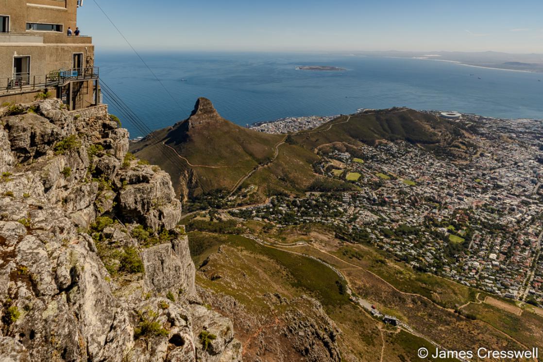 A photograph of the the view from the summit cable car station of Table Mountain, looking down on the city of Cape Town.